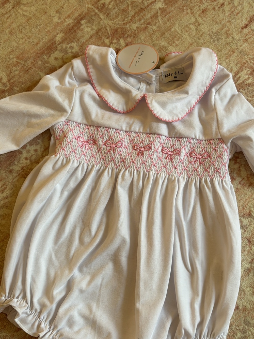 White One-Piece Bubble with Pink Smocked Detail